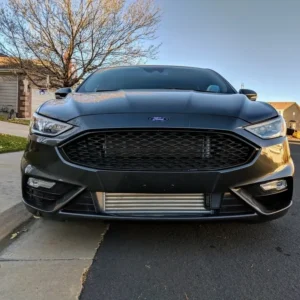 A black car parked on the side of a road.