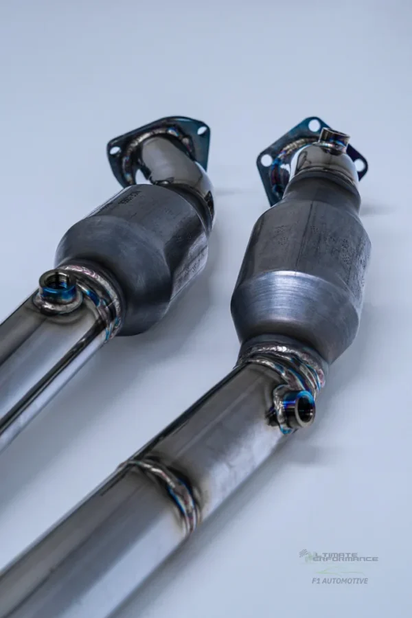 A pair of catalytic converters on top of each other.